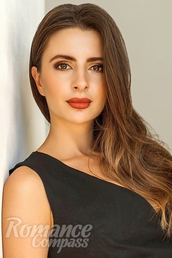 Ukrainian mail order bride Ksenia from Kyiv with light brown hair and hazel eye color - image 1