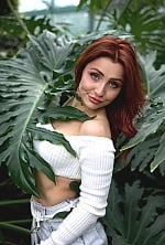 Ukrainian mail order bride Roksolana from Kyiv with auburn hair and green eye color - image 4