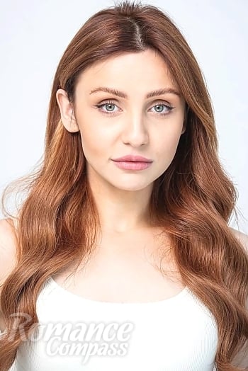 Ukrainian mail order bride Roksolana from Kyiv with auburn hair and green eye color - image 1