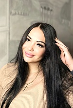Ukrainian mail order bride Anna from Bucharest with black hair and green eye color - image 3