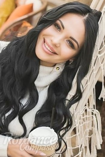 Ukrainian mail order bride Anna from Bucharest with black hair and green eye color - image 1