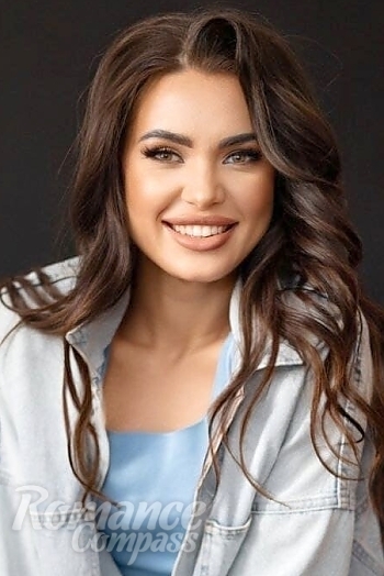 Ukrainian mail order bride Anna from Kyiv with black hair and green eye color - image 1