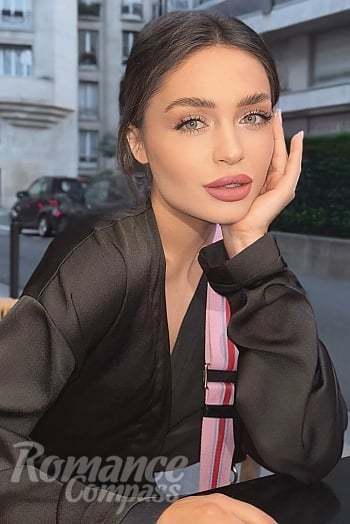 Ukrainian mail order bride Anastasia from Kyiv with black hair and green eye color - image 1