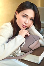 Ukrainian mail order bride Anastasia from Kyiv with black hair and green eye color - image 9