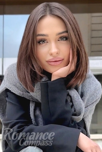 Ukrainian mail order bride Anastasia from Kyiv with black hair and green eye color - image 1