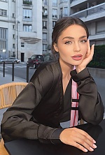Ukrainian mail order bride Anastasia from Kyiv with black hair and green eye color - image 7