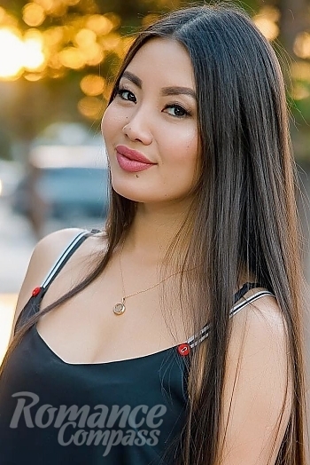 Ukrainian mail order bride Ainura from Astana with brunette hair and hazel eye color - image 1
