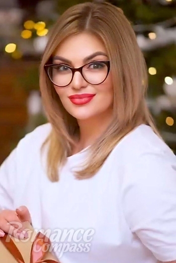 Ukrainian mail order bride Karina from Bucu with light brown hair and grey eye color - image 1