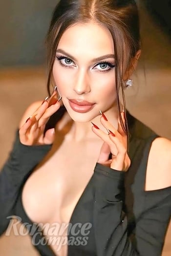 Ukrainian mail order bride Olena from Paris with light brown hair and green eye color - image 1