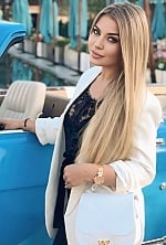 Ukrainian mail order bride Yuliia from Kyiv with blonde hair and blue eye color - image 5