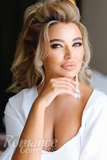 Ukrainian mail order bride Yuliia from Kyiv with blonde hair and blue eye color - image 1