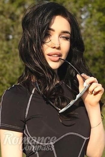 Ukrainian mail order bride Elena from Madrid with black hair and blue eye color - image 1