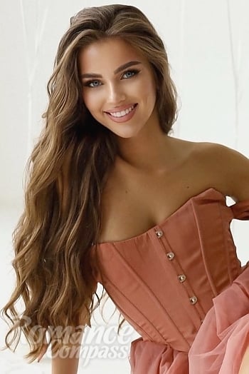 Ukrainian mail order bride Oksana from Madrid with light brown hair and blue eye color - image 1