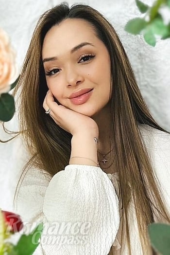 Ukrainian mail order bride Laura from Almaty with light brown hair and brown eye color - image 1
