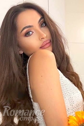 Ukrainian mail order bride Kamila from Madrid with light brown hair and green eye color - image 1