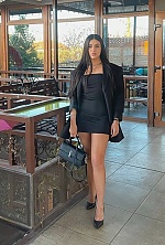 Ukrainian mail order bride Oksana from London with black hair and green eye color - image 4
