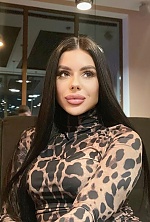 Ukrainian mail order bride Oksana from London with black hair and green eye color - image 5