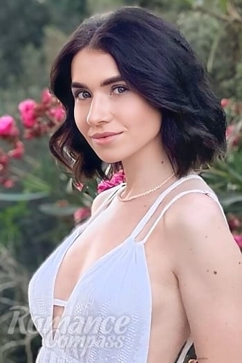 Ukrainian mail order bride Oksana from Lviv with black hair and blue eye color - image 1