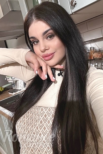 Ukrainian mail order bride Polina from Kyiv with black hair and green eye color - image 1