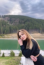 Ukrainian mail order bride Oksana from Lviv with light brown hair and green eye color - image 3