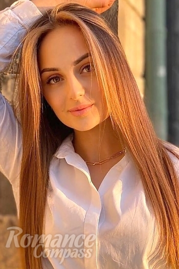 Ukrainian mail order bride Oksana from Lviv with light brown hair and green eye color - image 1