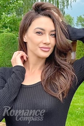 Ukrainian mail order bride Ulyana from Kyiv with light brown hair and green eye color - image 1