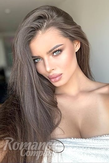 Ukrainian mail order bride Anastasiia from Linz with brunette hair and grey eye color - image 1