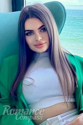 Ukrainian mail order bride Maria from Constanța with light brown hair and blue eye color - image 1