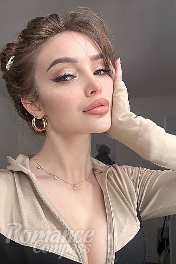 Ukrainian mail order bride Vladilena from Kyiv with light brown hair and green eye color - image 1