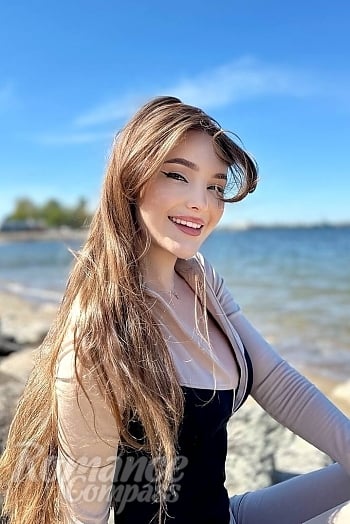 Ukrainian mail order bride Vladilena from Kyiv with light brown hair and green eye color - image 1
