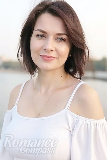 Ukrainian mail order bride Olga from Odesa with brunette hair and blue eye color - image 1
