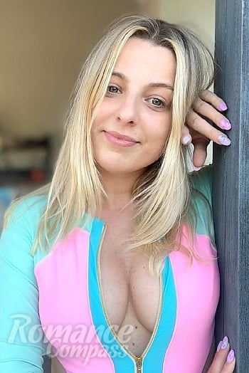 Ukrainian mail order bride Patrycja from Poznan with light brown hair and green eye color - image 1