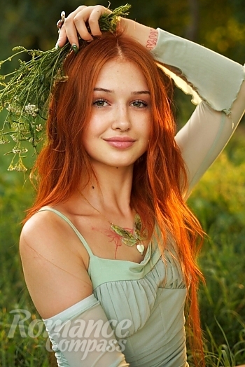Ukrainian mail order bride Christina from Ivano-Frankivsk with red hair and green eye color - image 1