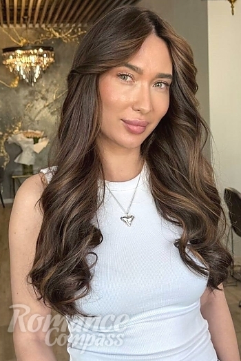 Ukrainian mail order bride Yevheniia from Kyiv with light brown hair and green eye color - image 1