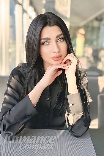 Ukrainian mail order bride Anna from Kharkiv with brunette hair and blue eye color - image 1