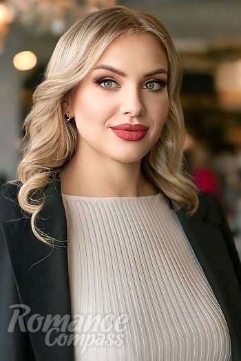 Ukrainian mail order bride Olga from Kyiv with blonde hair and green eye color - image 1