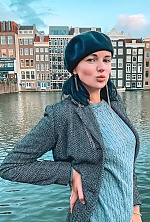 Ukrainian mail order bride Olena from München with black hair and green eye color - image 6