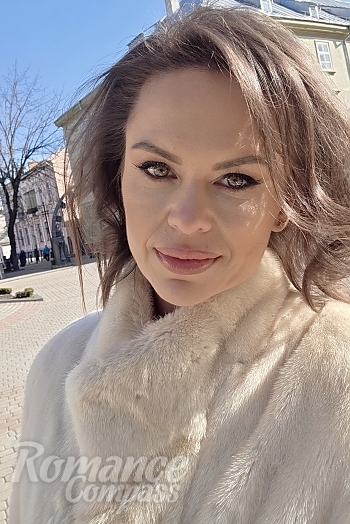 Ukrainian mail order bride Diana from Ivano-Frankivsk with black hair and green eye color - image 1