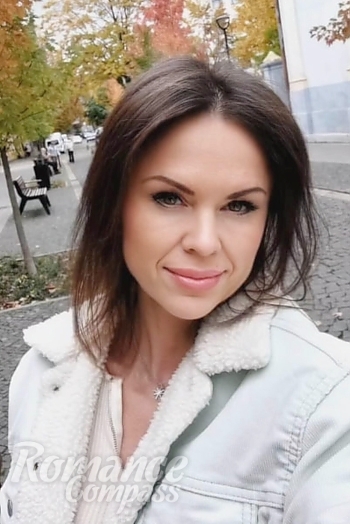 Ukrainian mail order bride Diana from Ivano-Frankivsk with black hair and green eye color - image 1