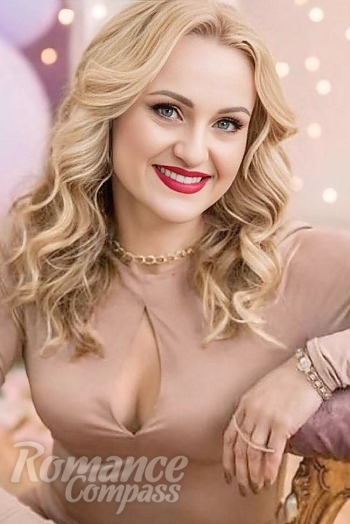 Ukrainian mail order bride Ilona from Paris with blonde hair and blue eye color - image 1