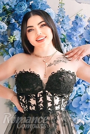 Ukrainian mail order bride Oksana from Mykolayiv with black hair and blue eye color - image 1