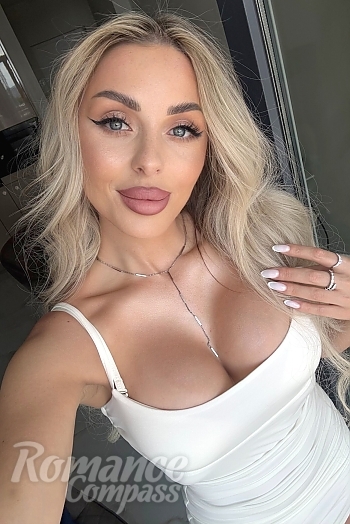 Ukrainian mail order bride Kristina from Madridejos with blonde hair and blue eye color - image 1