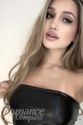 Ukrainian mail order bride Anastasiia from Warsaw with light brown hair and blue eye color - image 1
