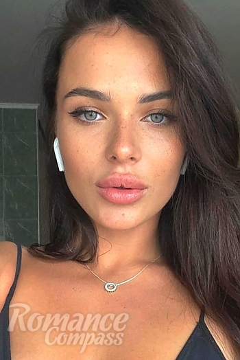 Ukrainian mail order bride Anastasia from London with light brown hair and green eye color - image 1