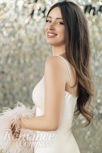 Ukrainian mail order bride Yana from Kyiv with black hair and blue eye color - image 1