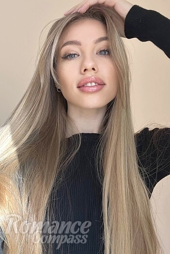 Ukrainian mail order bride Oksana from Nice with light brown hair and blue eye color - image 1