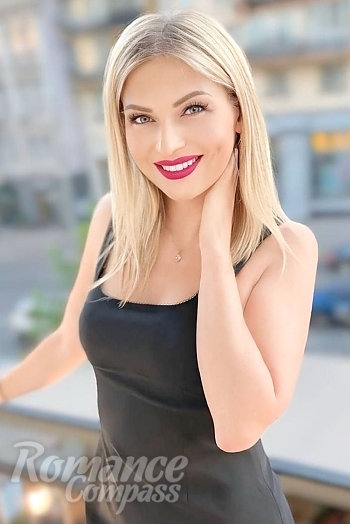 Ukrainian mail order bride Antonina from Paris with blonde hair and green eye color - image 1