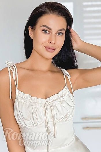 Ukrainian mail order bride Anna from Kyiv with black hair and green eye color - image 1