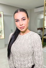 Ukrainian mail order bride Anna from Kyiv with black hair and green eye color - image 6