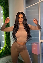 Ukrainian mail order bride Ksenia from Rivne with black hair and green eye color - image 8